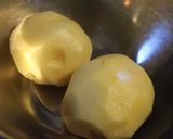 A picture of step 1 of Double Cheese Rice Flour and Potato Fritters in a Frying Pan.