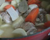 A picture of step 9 of Easy Rich Cream Stew in a Le Creuset Pot.