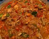 A picture of step 4 of Spanish style tomato and chicken baked rice.