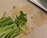 A picture of step 3 of Chicken Hearts Yakitori style (no skewer) Leek Green on top.