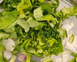 A picture of step 1 of Radish capsicum sring onion junka by Shobha Rathod (green sabji).