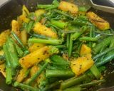 A picture of step 3 of Onion stalk stir fried with Potato.