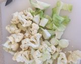 A picture of step 1 of Broccoli and Cauliflower Cheese with Onions.