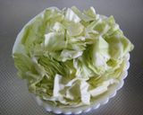 A picture of step 1 of Steamed Salmon and Cabbage with Cheese.
