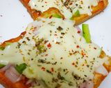 A picture of step 2 of Cheesy bread pizza.