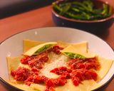 A picture of step 16 of Cheats Pea and Ricotta Ravioli with Rich Tomato Sauce.
