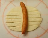 A picture of step 2 of Wiener Sausage Bread.