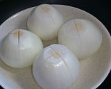 A picture of step 2 of Chinese Soup with Ground Chicken and a Whole Onion.