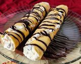 Foto del paso 7 de la receta: 🫔Panqueques rellenos de manzana, pasas y crema, bañados con salsa de chocolate🫔 Canelones dulces