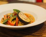A picture of step 9 of Beef and grilled aubergine red curry topped with Bird eye chillis.