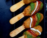 A picture of step 7 of Semolina pop sticks.