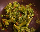 A picture of step 2 of Chrysanthemum Greens and Chikuwa Fishstick Kinpira.
