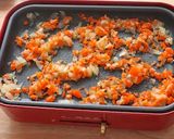 A picture of step 3 of Curry Flavored Paella Cooked on an Electric Griddle.