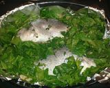 A picture of step 3 of Sea Bass with spinach and white wine.