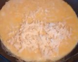 A picture of step 4 of 3 egg and cheese omelette.