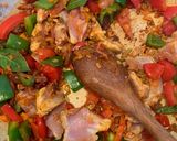 A picture of step 2 of Spanish style tomato and chicken baked rice.