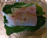 A picture of step 3 of Sea bass on a bed of pak Choy & quinoa with lemon sauce 420 calories.