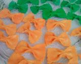 A picture of step 17 of Homemade farfalle pasta in three colour.