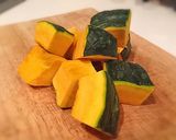 A picture of step 1 of Simmered Kabocha Squash in a Staub Cocotte.