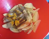 A picture of step 2 of Rosemary baked potato wedges.