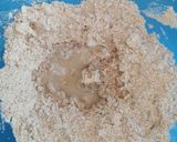 A picture of step 4 of Wholegrain chapati with onion and coriander.