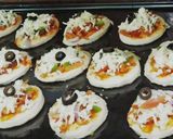 A picture of step 18 of Mini Pizzas.