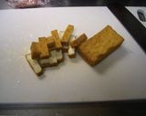 A picture of step 2 of Stir-fried and Simmered Daikon Radish, Pork, and Atsuage.