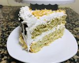 A picture of step 8 of Coconut cake with whipped cream frosting 🤤🤤🤤.
