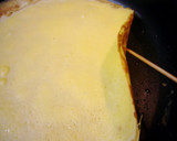 A picture of step 4 of Easy Crepes with Pancake Mix in a Frying Pan.
