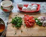 A picture of step 1 of Egg tomato onion omlette.