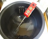 A picture of step 3 of Confit-Style Grilled Chicken Cooking with a Rice Cooker on Low Heat.