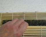 A picture of step 11 of Salad Roll (with rolling instructions).