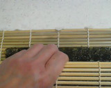 A picture of step 11 of Salad Roll (with rolling instructions).