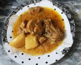 A picture of step 10 of Alo chicken.