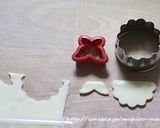A picture of step 8 of Christmas Character Bento with Santa Claus and a Reindeer.