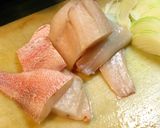 A picture of step 1 of White Fish Simmered with Tomatoes.