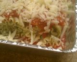 A picture of step 11 of Pesto Turkey Florentine Lasagna Roll Ups.