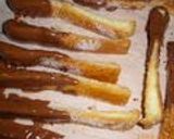 A picture of step 10 of Valentine's Day Chocolate Stick Rusks Made With Bread Crusts.