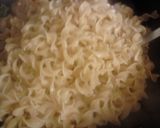 A picture of step 15 of Garlic Parmisan Pork Noodle Skillet.