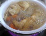 A picture of step 6 of Simmered Daikon Radish, Carrot, Shiitake Mushrooms and Aburaage.