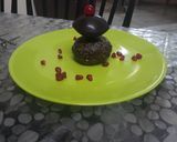 A picture of step 8 of Chocolate Disc on chocolate cup cake.