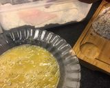 Foto del paso 4 de la receta Pollo empanado con ajo y rúcula