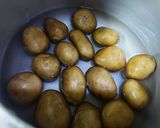 A picture of step 1 of Malai Dum Aloo with Green Peas.
