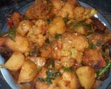 A picture of step 30 of Aloo fulcopi katla rosha ar misti doi.
