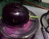 A picture of step 1 of Baingan Bharta.