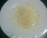 Foto del paso 7 de la receta: Bacalao desmigado con pimientos sobre lombarda con sésamo y queso parmesano