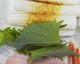A picture of step 1 of Character Bento Shiso, Ham, and Imitation Crab Chikuwa Rolls..