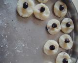 A picture of step 3 of Chocolate coated Hazelnut filled coconut laddu.