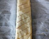 A picture of step 3 of Parma ham and smoked cheese roll up pie.