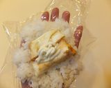 A picture of step 4 of Onigiri (Rice Ball) with Fried Egg.